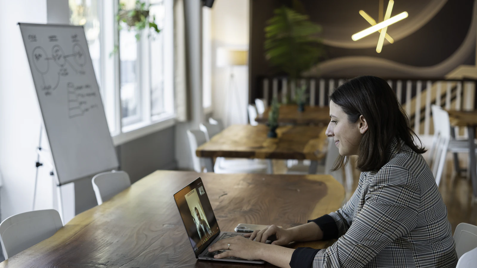 Split view comparing an executive assistant at a desk with a virtual assistant working remotely on a laptop