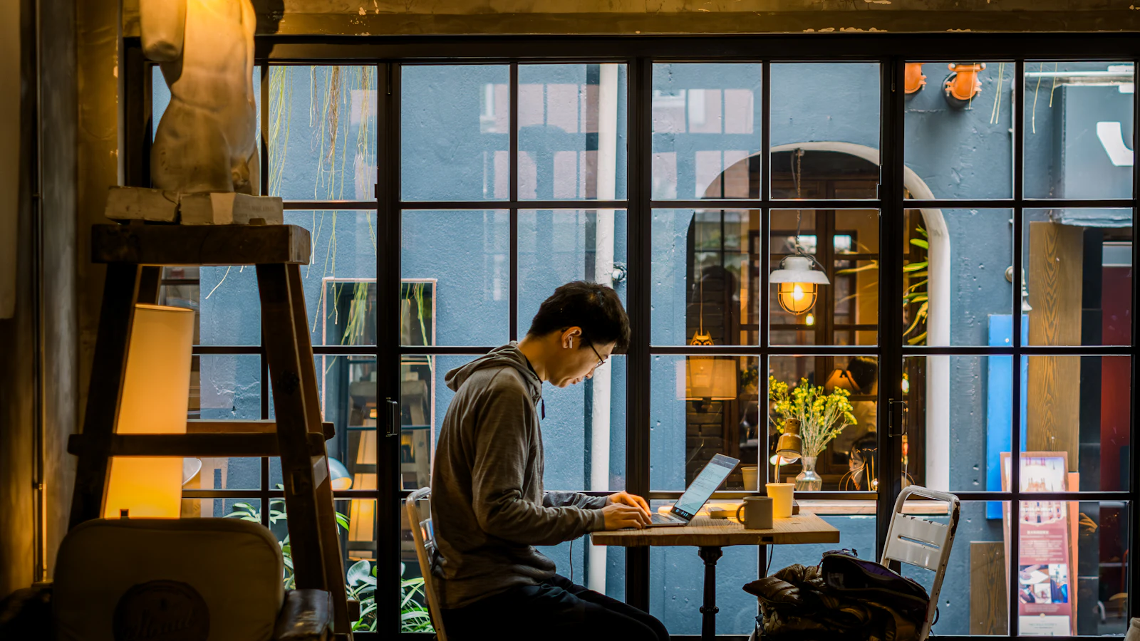 Confident Filipino virtual assistant working from a tidy home office