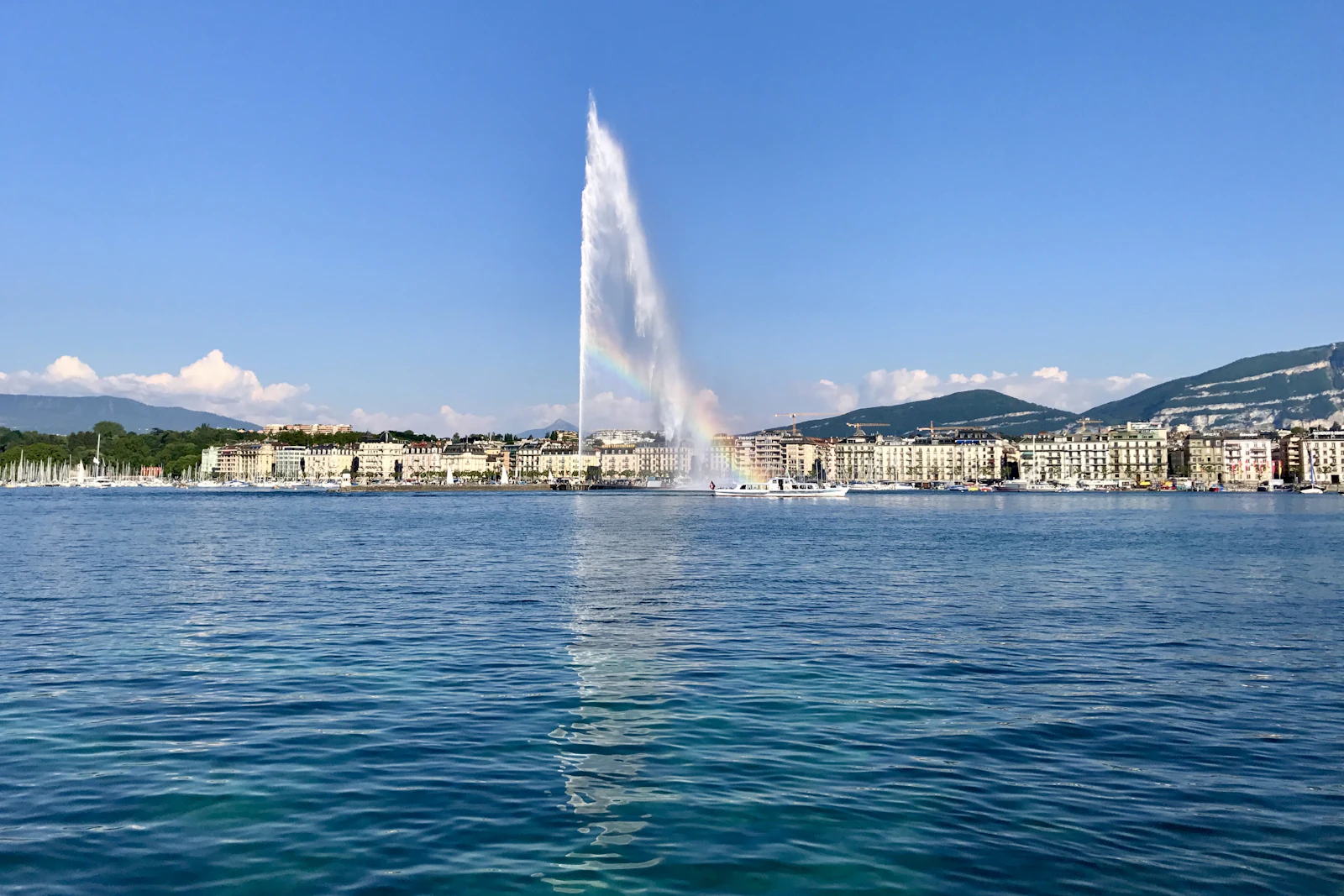 Lake Geneva with the Jet d'Eau fountain under a soft sky