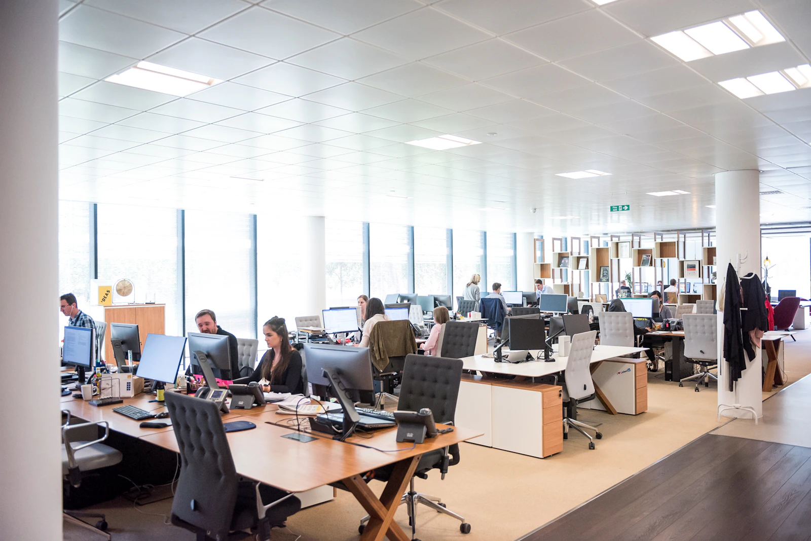 Filipino virtual assistants working together in a warm, professional workspace
