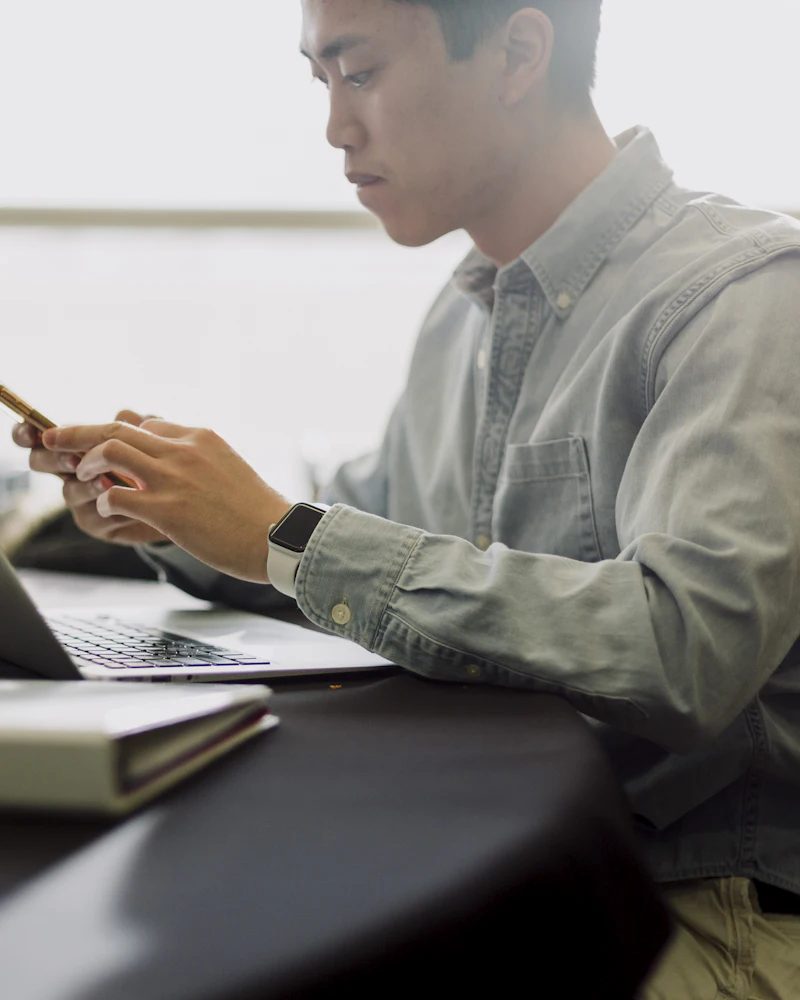 Asian remote professional working on a design project from a home office